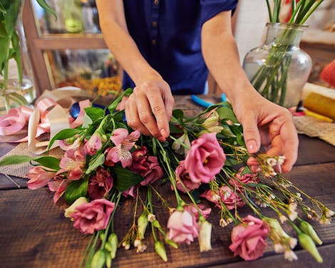 The skilled hands of a local floral designer ply their trade
